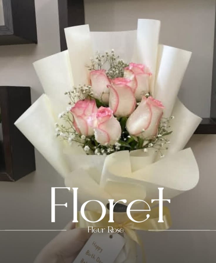 Fleur Rose — A white rose says what the heart cannot
